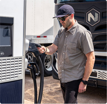 Man charging an electric truck Man charging an electric truck